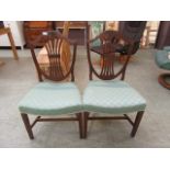 A pair of wheat design dining chairs