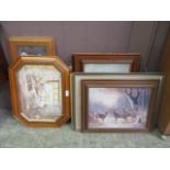 An assortment of framed and glazed prints of various subjects
