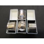 Four assorted silver hallmarked napkin rings weighing approximately 71.