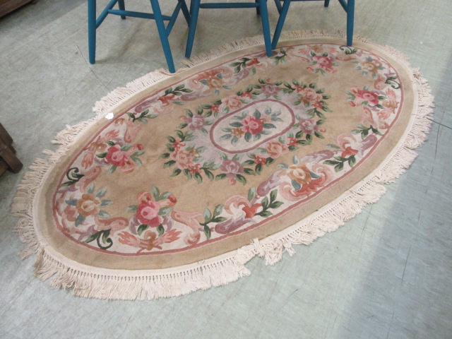 A Chinese style oval rug