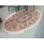 A Chinese style oval rug