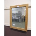 An oak framed wall mirror