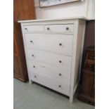 A modern white laminated chest of two short over four long drawers