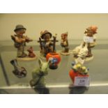 Eight pieces of Hummel ceramics to include children, animals,