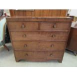 An early 19th century mahogany chest of two short over three long drawers