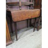 An 18th century oak drop leaf table