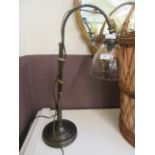 A reproduction metalwork desk lamp with glass shade