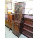 A reproduction mahogany bow front bookcase,