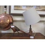 A modern table lamp in the form of a strutting pheasant