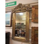 A modern ornate gilt framed rectangular mirror