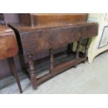 An early 18th century oak drop leaf table (A/F)