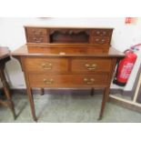 An Edwardian mahogany and satinwood banded dressing chest,