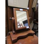 A 19th century mahogany swing toilet mirror