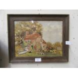 A framed and glazed watercolour of cottage signed Y.T.