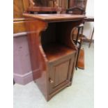 An early 20th century mahogany pot cupboard,