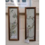 A pair of framed oriental paintings on tiles of birds on branches CONDITION REPORT: