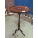 A reproduction mahogany and boxwood strung wine table