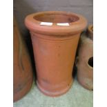 A terracotta chimney pot