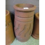 A terracotta chimney pot