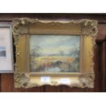 An ornate gilt framed oil on board of river through countryside scene signed R.