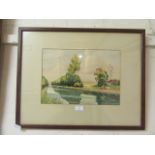 A framed and glazed watercolour of river through countryside scene signed C.