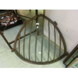 A cast iron corner hay rack