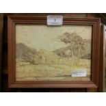 A framed and glazed paper bark picture of cottage in landscape scene