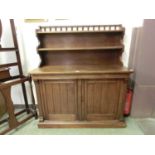 A late 19th century walnut side cabinet, the super structure with galleried top over open shelving