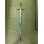 A stainless steel and brass cross sword