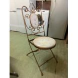A gold painted metalwork folding chair