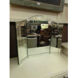 A bevel glass edged triple vanity mirror