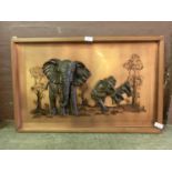 A copper wall artwork of elephants (A/F)