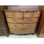 An early 29th century mahogany bow front chest of two short over three long drawers on turned feet