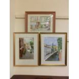 Three framed and glazed watercolours of continental street scenes signed Carmichael