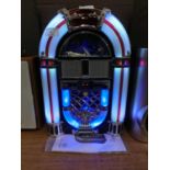 A compact disk player in the form of a lighted jukebox