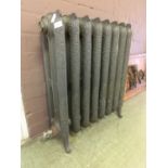 A 19th century cast iron radiator with scrolling design