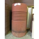 A terracotta chimney pot