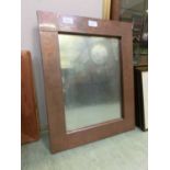 A copper framed mirror