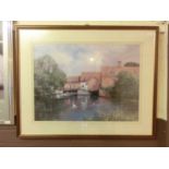 A framed and glazed print of lake scene