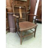 An Edwardian rosewood, boxwood strung, and marquetry open arm chair