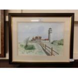 A framed and glazed watercolour of lighthouse signed Carmichael