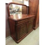 A 19th century mahogany chemist's cabinet, the mirrored back with gilt lettering 'Joseph Clarke