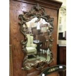 A modern Rococo style moulded framed mirror