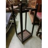 An early 20th century oak umbrella stand