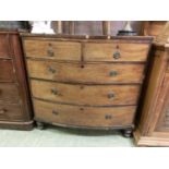 +VAT A 19th century mahogany bow fronted chest of two short over three long drawers on turned feet