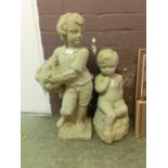 Two garden stoneware statues of young children