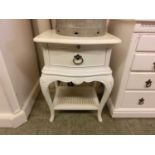 A reproduction cream bedside cabinet having a drawer above open storage