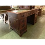 A reproduction yew effect twin pedestal desk