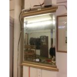 A gilt framed bevel glass wall mirror made in Cheshire