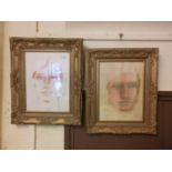 A pair of ornate gilt framed watercolours of faces